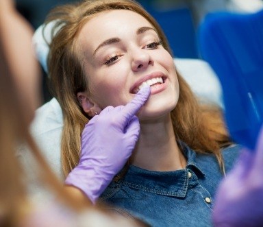 Woman sharing flawless smile after dental bonding