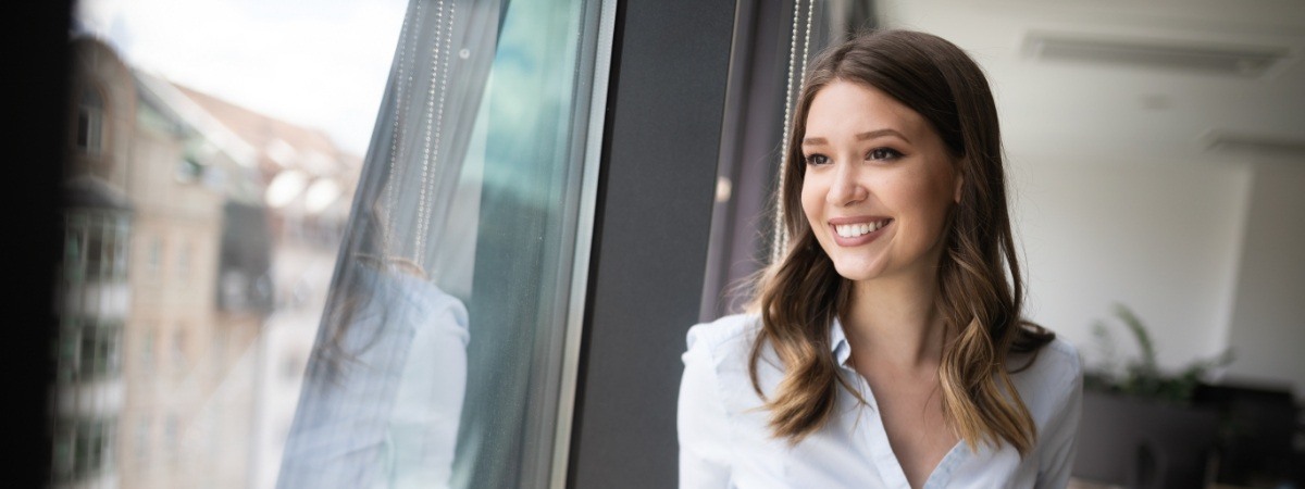 Woman sharing flawless smile after dental bonding