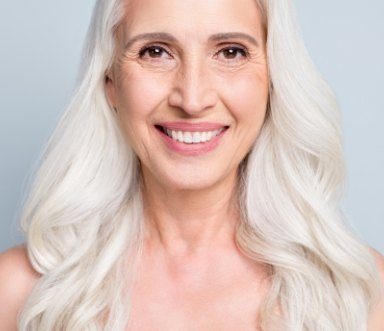 Woman smiling after Botox facial rejuvenation