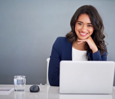 Woman smiling after discussing six month smiles frequently asked questions