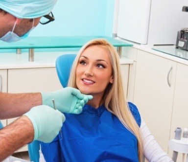 Woman receiving an oral cancer screening