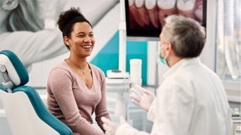 patient talking to dentist