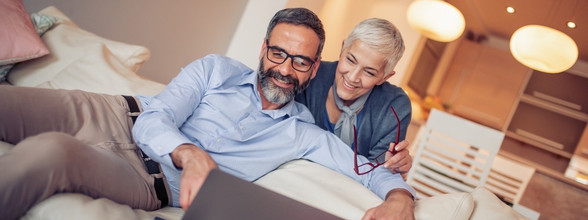 Man and woman smiling after CEREC one day dental crowns