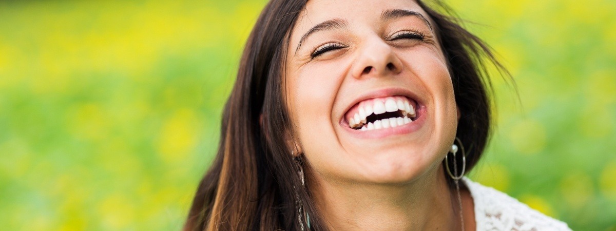 Woman sharing flawless smile after cosmetic dentistry