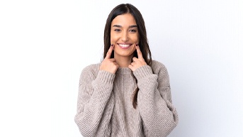 woman smiling after knowing which cosmetic treatment is right for her