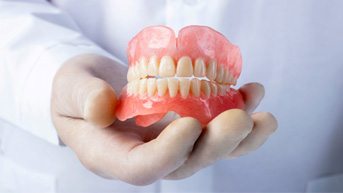 lab tech and cost of dentures in Burlington