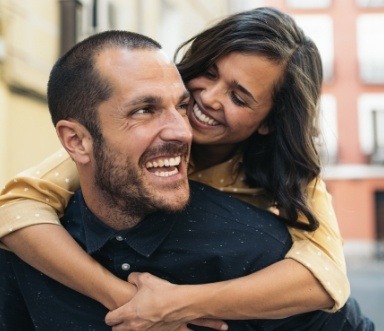 Man and woman enjoying the benefits of tooth colored fillings