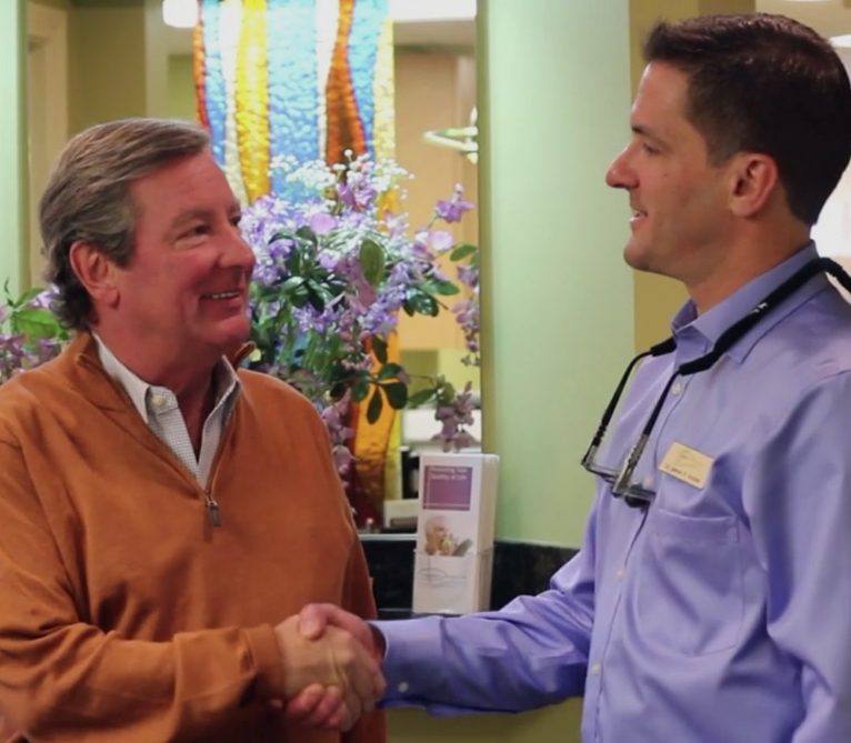 Burlington dentist shaking hands with dental patient