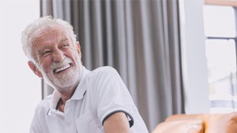 Man laughing with dentures