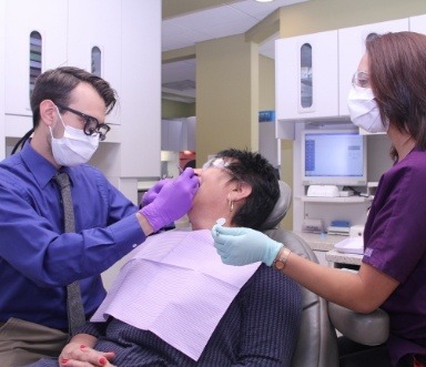 Dentist treating dental patient
