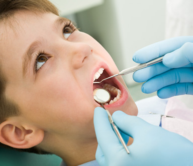 Young patient having their teeth checked 