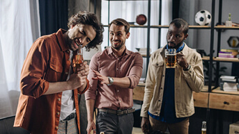 man opening bottle with teeth