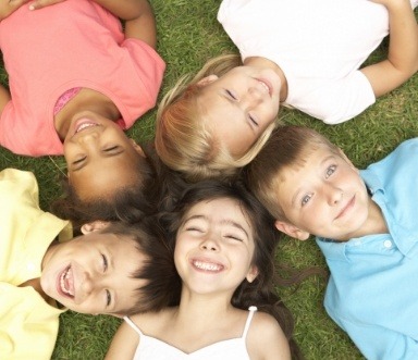 Group of children smiling after pediatric dentistry visit