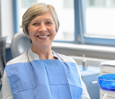 Senior dental patient smiling and waiting for treatment 