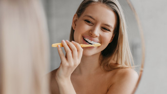 Woman brushing her teeth