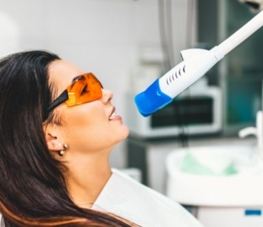 Dental patient receiving in office teeth whitening