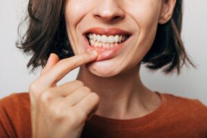 Woman showing off gums.