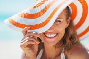 portrait of a smiling woman in hat