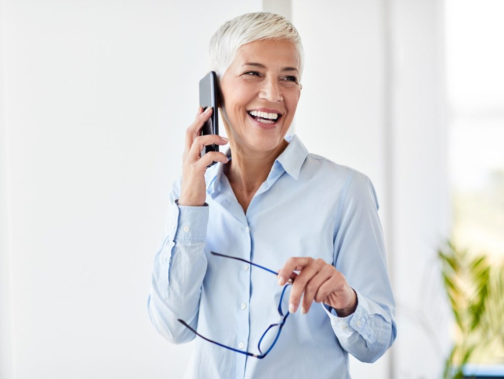Closeup of mature woman smiling while on the phone
