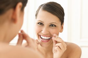 For a healthier smile, the dentist in Burlington recommends flossing at least once a day. 